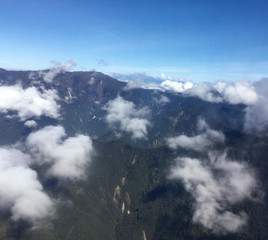 Close view of cloud wrapped mountains as flying into land at Mount Hagen in Papua New Guinea