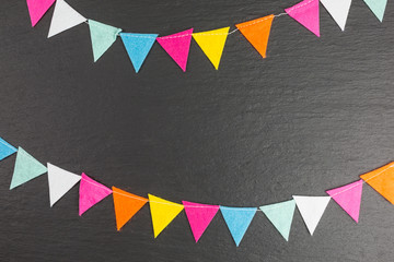 background of colorful felt bunting with copy space