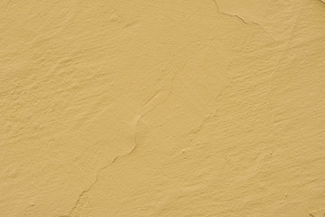 Fototapeta na wymiar old yellow painted wall backgtound texture