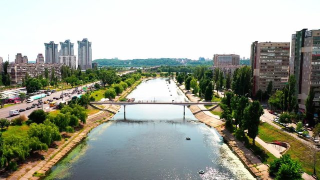 4K, Drone, Slow moving shot of the water canal and apartment buildings at Rusanovka Island, Ukraine.