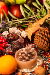 Close Up of Table decorated with Autumn and Winter Fruits and Edibles