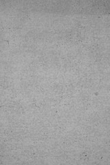 Gray concrete wall, gray background, gray structure with rough and scratched stucco patterns in indiustrial design. Gray stone wall as a background and design element.