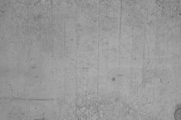 Graue Betonmauer, Grauer Hintergrund, Grau Struktur mit groben und zerkratzen Stzrukturen im Indiustrial Design. Graue Steinmauer als Hintergrund und gestalterisches Element.