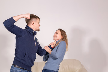 People and abuse concept - Portrait of angry young man try to hit the woman