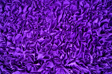 Delicate purple background silk fabric, Background texture. The purple fabric that is attached to the wooden wall has various shapes for background.