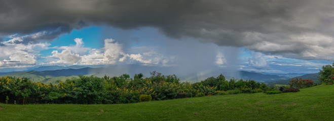 view panorama of heavy raining on top hill with dark cloudys background at Phu Chu Camp Ground, Sri...