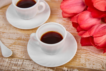 Two cup of coffee mug with pink tulip flowers