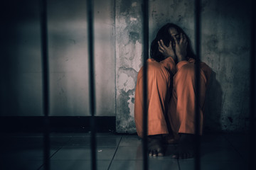 Portrait of women desperate to catch the iron prison,prisoner concept,thailand people,Hope to be...
