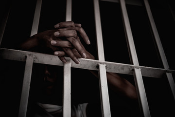 Hands of women desperate to catch the iron prison,prisoner concept,thailand people,Hope to be...