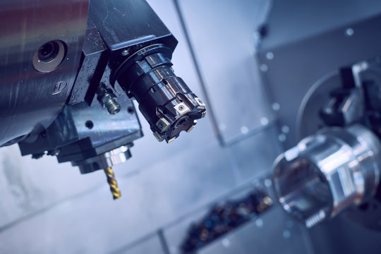 cnc machine at metalwork industry. milling multitool precision manufacturing and metal machining