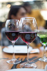 red wine on open air restaurant cafe romantic joyful young adults table