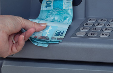 Brazilian money withdrawn from an ATM
