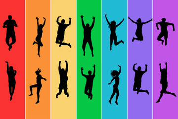 Silhouettes of people jumping on rainbow background