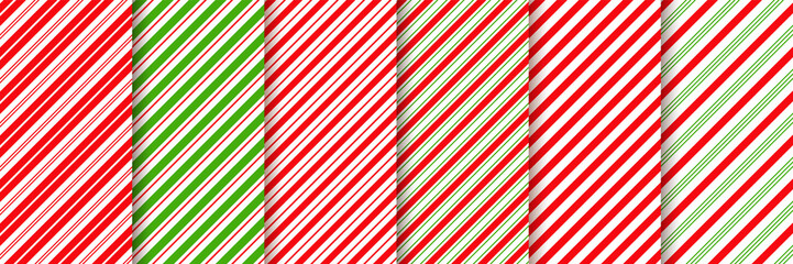 Obraz premium Cane candy pattern. Vector. Christmas stripes seamless background. Diagonal red green peppermint backdrop. Holiday traditional wrapping paper. Abstract texture. Sugar lollipop illustration.