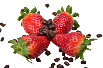 Four ripe summer strawberries with bright green leaves and grains of aromatic coffee on a neutral white background