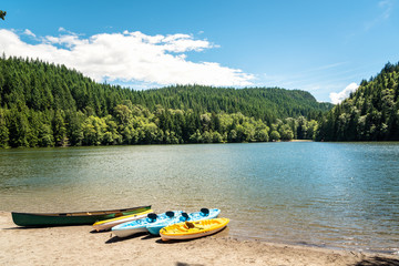 Rowing boats on a sandy beach on a beautiful mountain lake in Canada on a sunny summer day