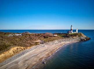 Montauk Lighthouse and beach aerial shot, Long Island, New York, USA.