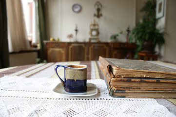 black coffee mug. a small cup of black classic coffee at home in a vintage cup