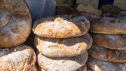 Artisan bread. Table with loaves of bread made by hand at a medieval fair in spain