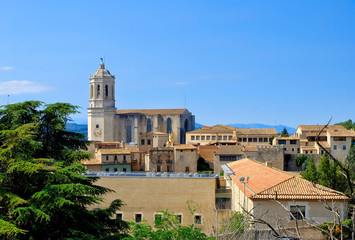 Fototapeta na wymiar The bell tower of Sant Feliu Collegiate Church, from the Cathedral of Saint Mary of Girona, Girona, Catalonia, Spain.