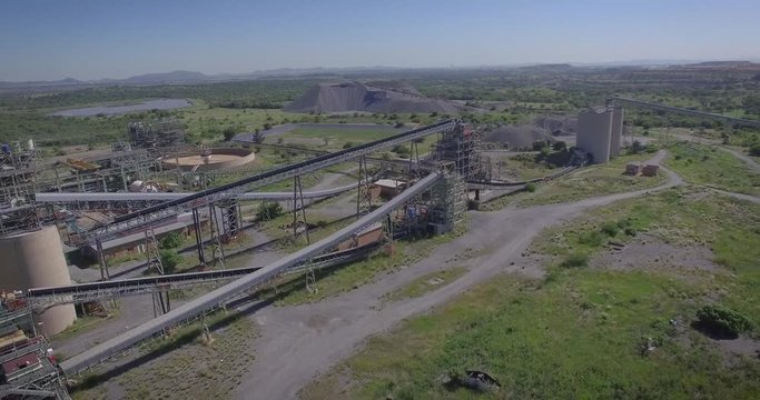 An aerial drone view of a closed, abandoned mine ore processing plant