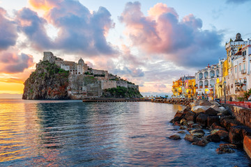 Aragonese Castle and Ischia town on sunrise, Italy - obrazy, fototapety, plakaty