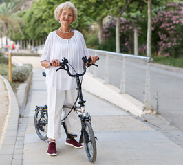 Elderly woman going to biking