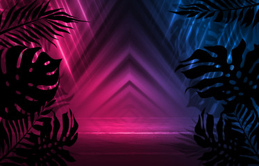 Background of empty dark scenes with neon lights and shapes, smoke. Silhouettes of tropical palm leaves in the foreground. Bright futuristic abstract background
