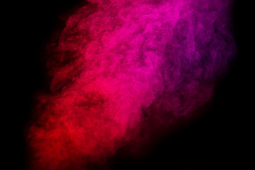 Bright red and pink smoke isolated on black background