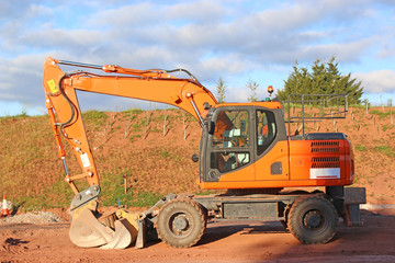 Digger working on a road construction site