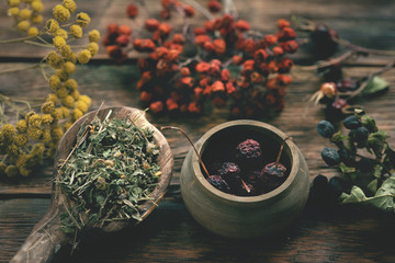 Witch doctor table with various dried ingridients above. Witchcraft concept.