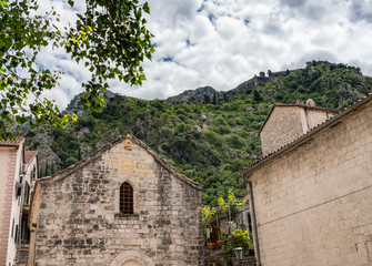 Fototapeta na wymiar St Michael's Church on pedestrian streets of old town Kotor in Montenegro