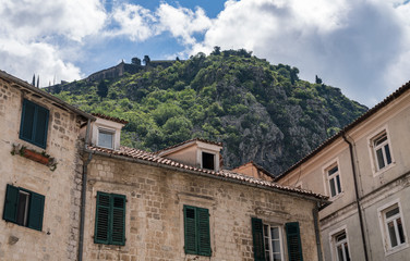 Fototapeta na wymiar Green shutters on house in streets of old town Kotor in Montenegro