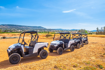 Tourist all-terrain vehicles. Sightseeing by tourist cars. Visiting places of tourist interest. The transportation of tourists to sights. Tourism. Journey.