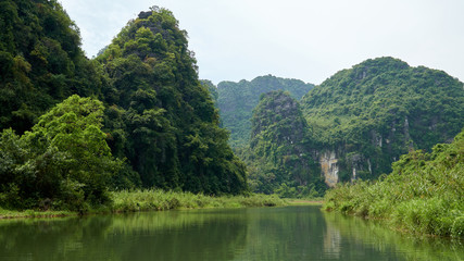 River, karst mountains and tropic forest in Trang An, Tam Coc, Ninh Binh, Vietnam.