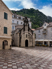 Fototapeta na wymiar St Luke's Church on pedestrian streets of old town Kotor in Montenegro
