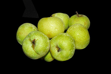green apples on black isolated background