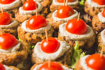 Tasty vegan burger sandwiches with cherry tomato on top