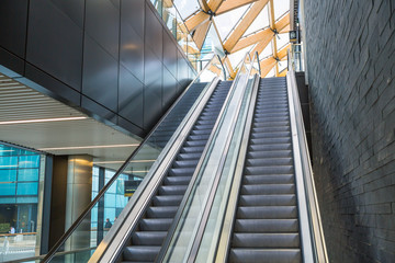 Escalators in an train station. Empty escalator stairs. Modern escalator in public building, shopping mall, Department store. Empty, no people
