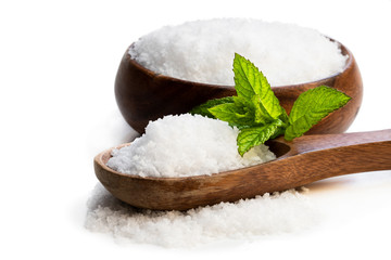 Wooden spoon with sea salt isolated on white