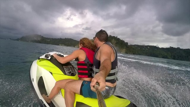 Couple Riding on Jetski in the Ocean