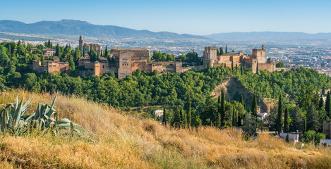 Fototapeta na wymiar Panoramic sight of the Alhambra Palace in Granada in the late afternoon sun. Andalusia, Spain.