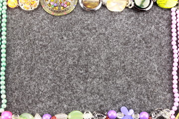 gemstone jewelry on grey background