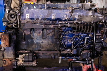 Mechanic opened the locking valve mechanism. Disassemble engine block vehicle. Old motor capital repair. Car service concept