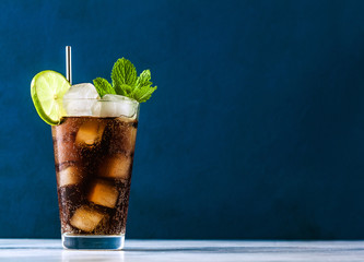 Coca Coke cocktail in a tall glass cuba libre. refreshing summer drink