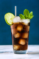 Coca Coke cocktail in a tall glass cuba libre. refreshing summer drink