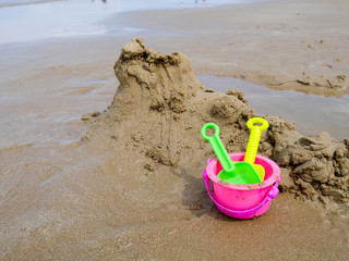 Fototapeta na wymiar bucket and spade for children on the beach summer concept..