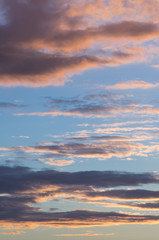 Fototapeta na wymiar Sunset in the evening sky. Clouds on blue sky