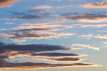 Fototapeta premium Sunset in the evening sky. Clouds on blue sky