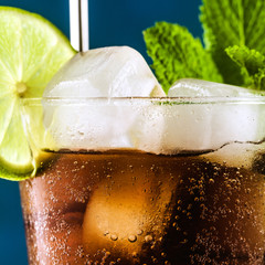 Coca Coke cocktail in a tall glass cuba libre. refreshing summer drink